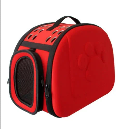Red pet carrier with black accents on a white background