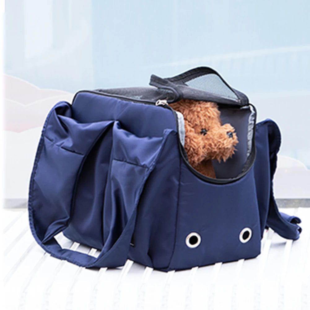 Navy blue pet carrier with a small brown dog peeking out on a light blue background