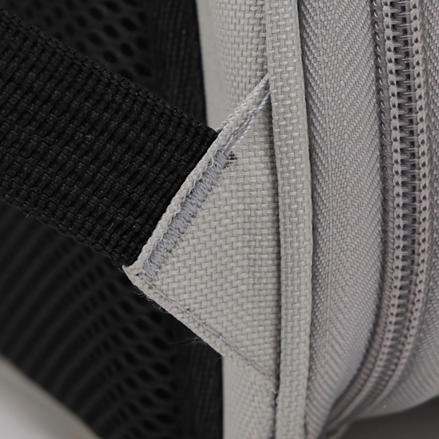 Close-up of black and gray fabric with a zipper