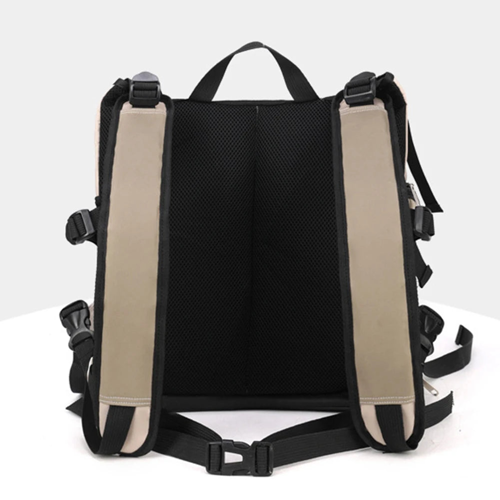 Back view of a black backpack with beige shoulder straps on a white background