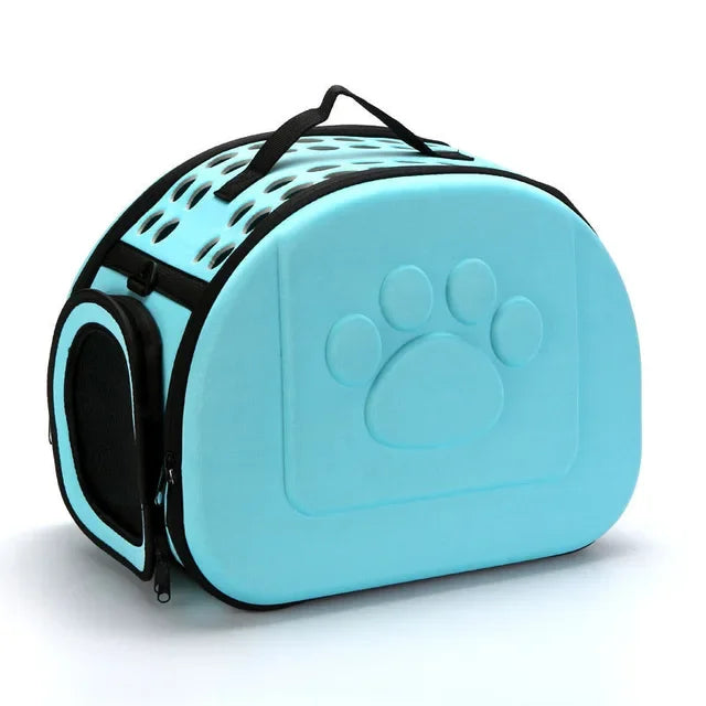 Turquoise pet carrier with a paw print design on a white background