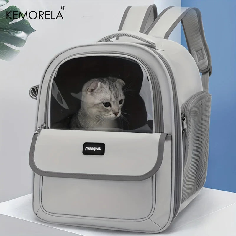 Cat in a gray pet carrier with 'KEMORELA' branding on a white background
