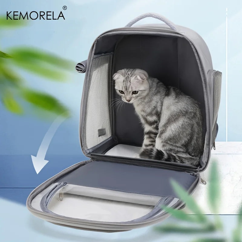 Cat sitting inside a gray pet carrier with a light blue background and 'KEMORELA' branding.