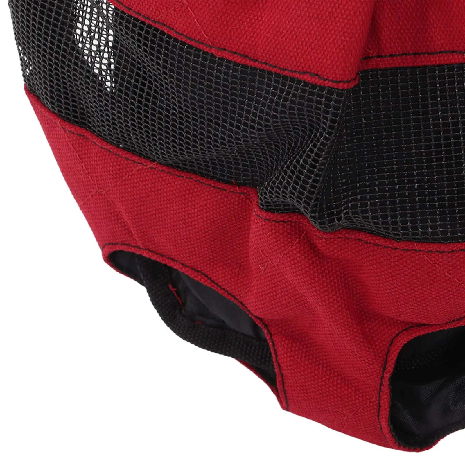 Red pet carrier with black mesh side on a white background