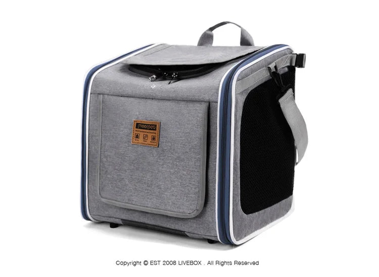 Gray pet carrier with a visible brand logo on a white background