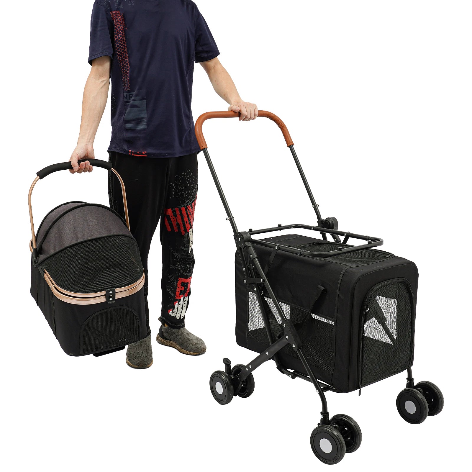 Person holding a black pet stroller and carrier on a white background