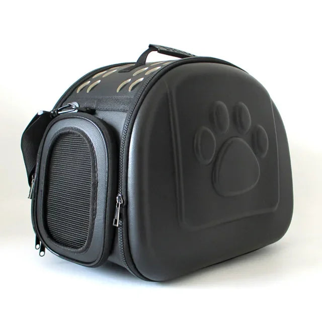 Black pet carrier with a paw print design on a white background