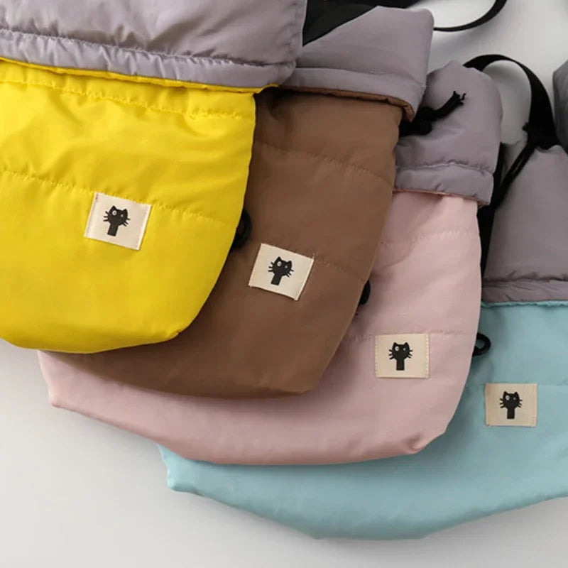 Four colorful bags with a small label on a light gray background