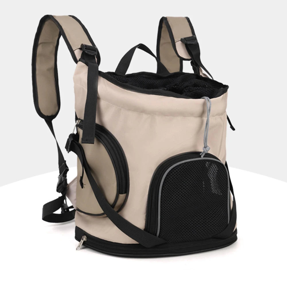 Beige and black pet carrier backpack on a white background