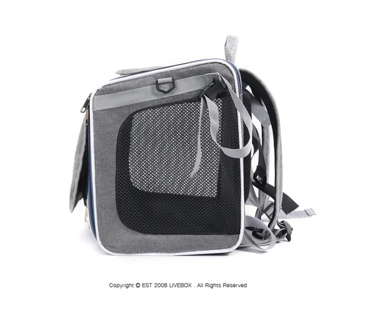 Gray pet carrier with mesh side on a white background