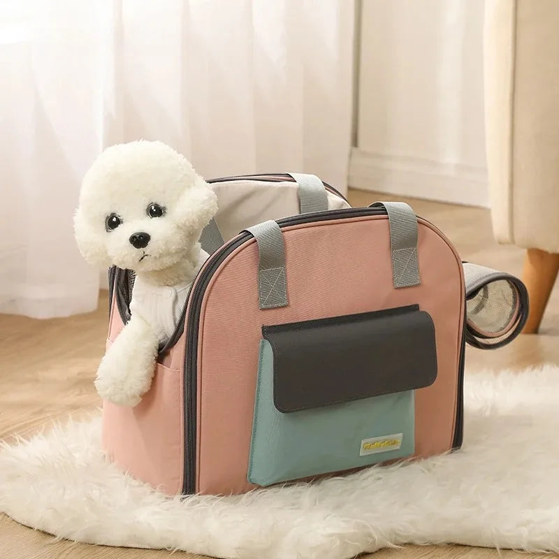 Pink pet carrier with a white teddy bear inside, placed on a wooden floor.