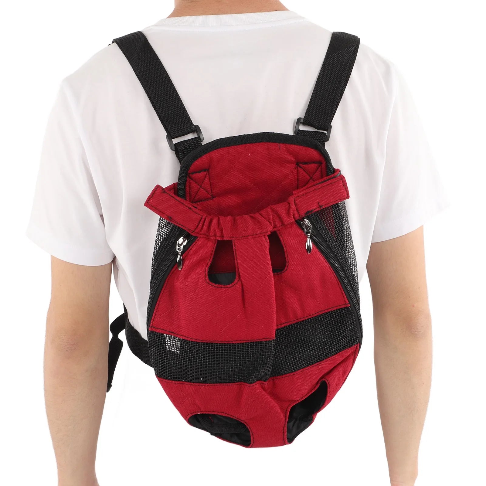 Red and black pet carrier backpack worn by a person on a white background