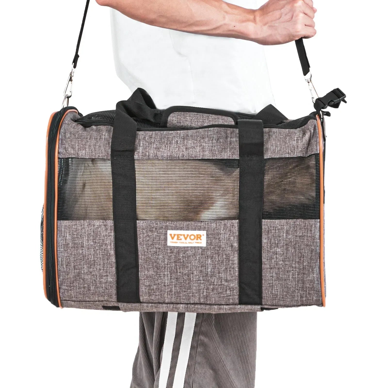 Person holding a gray pet carrier with black straps, featuring the VEVOR brand logo.