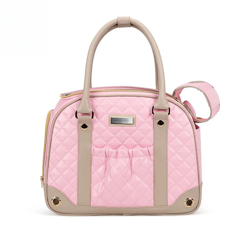 Pink quilted pet carrier with beige accents on a white background