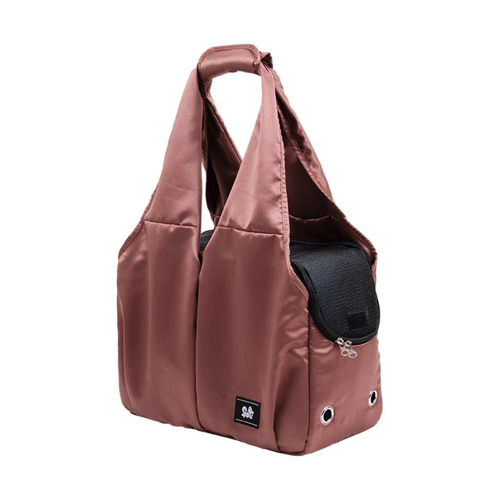 Brown shoulder bag with a black pocket on a white background