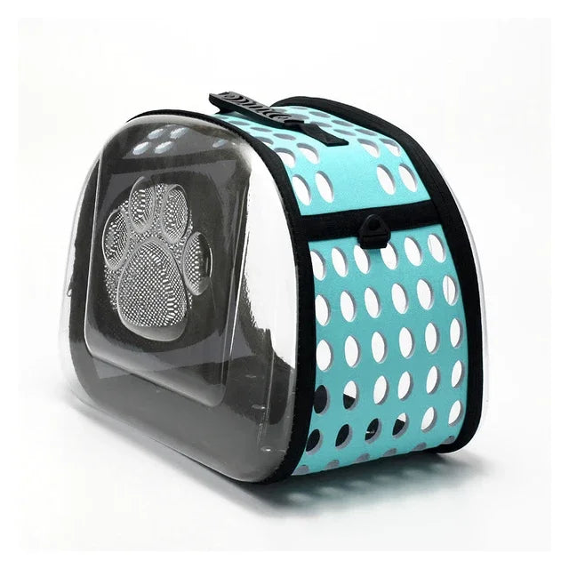 Pet carrier with turquoise polka dot design on a white background