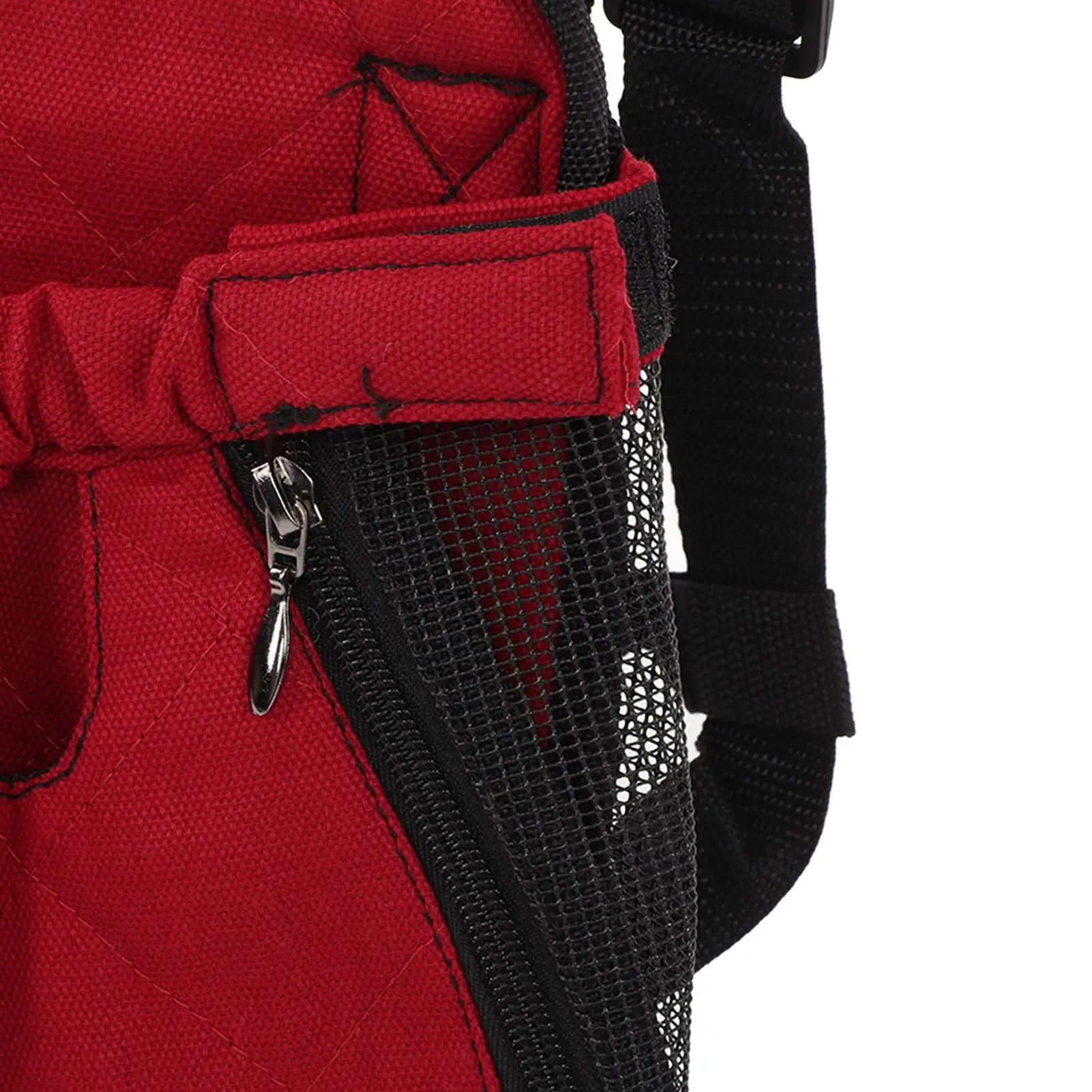 Close-up of a red and black baby carrier with a zipper detail on a white background