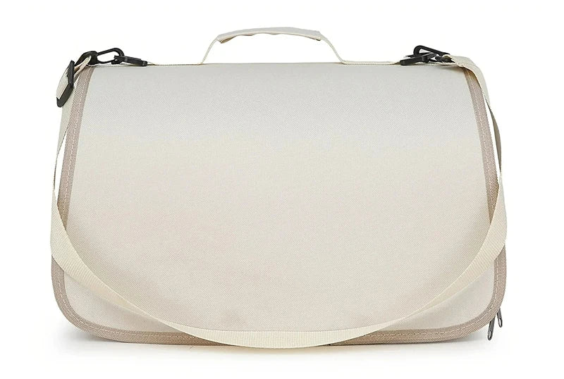 Beige shoulder bag with a strap on a white background