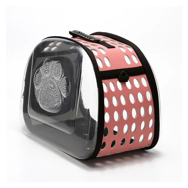 Pet carrier with pink polka dot design on a white background