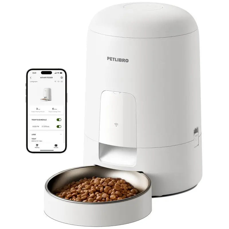 White pet food dispenser with a bowl of kibble and smartphone displaying app interface on a white background