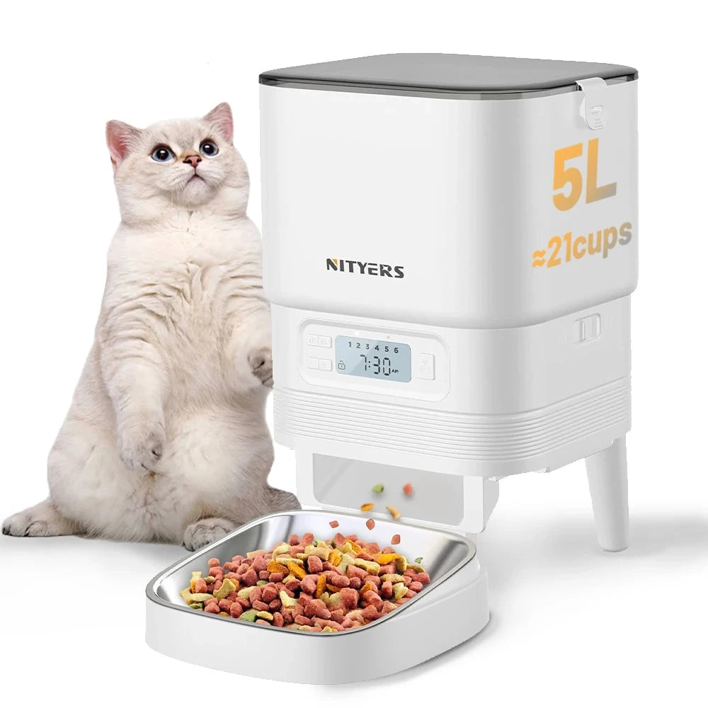 Nityers pet feeder with a cat sitting next to it on a white background