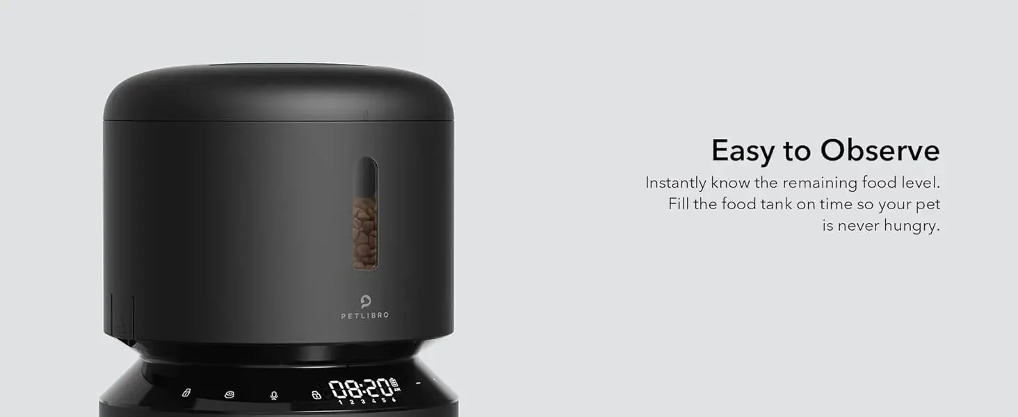 Black pet food dispenser with digital display on a gray background