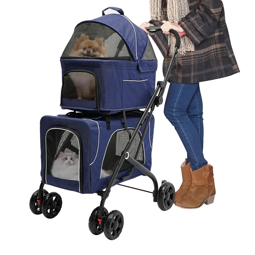 Blue pet stroller with two small dogs inside, being pushed by a person wearing a plaid coat and brown boots.