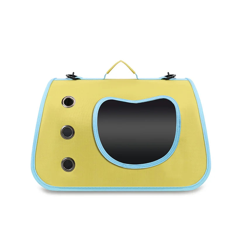 Yellow pet carrier with a black interior on a white background