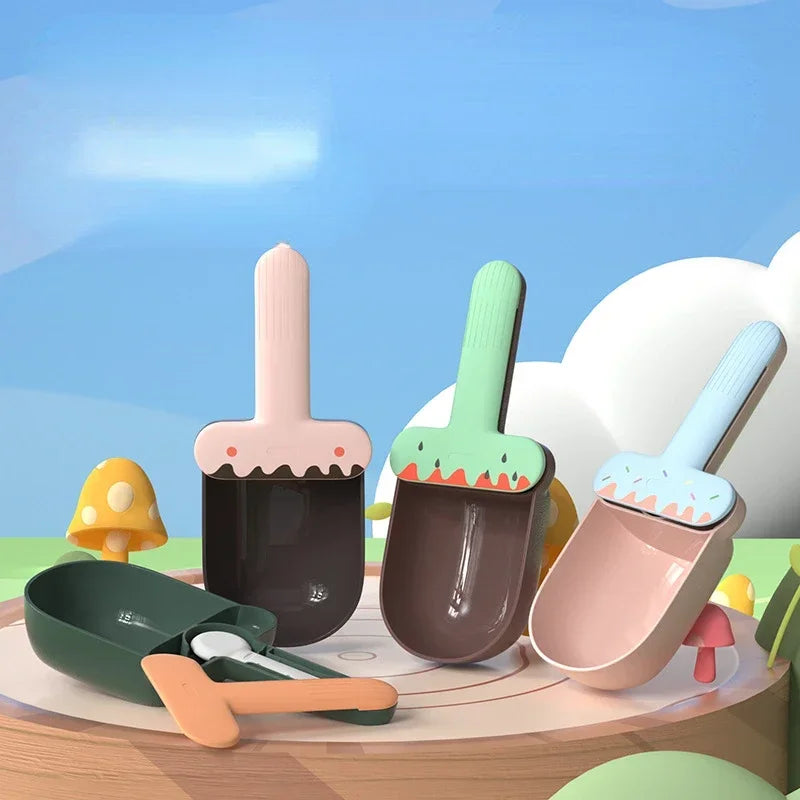 Set of colorful children's toy shovels and buckets on a wooden surface with a blue sky background.