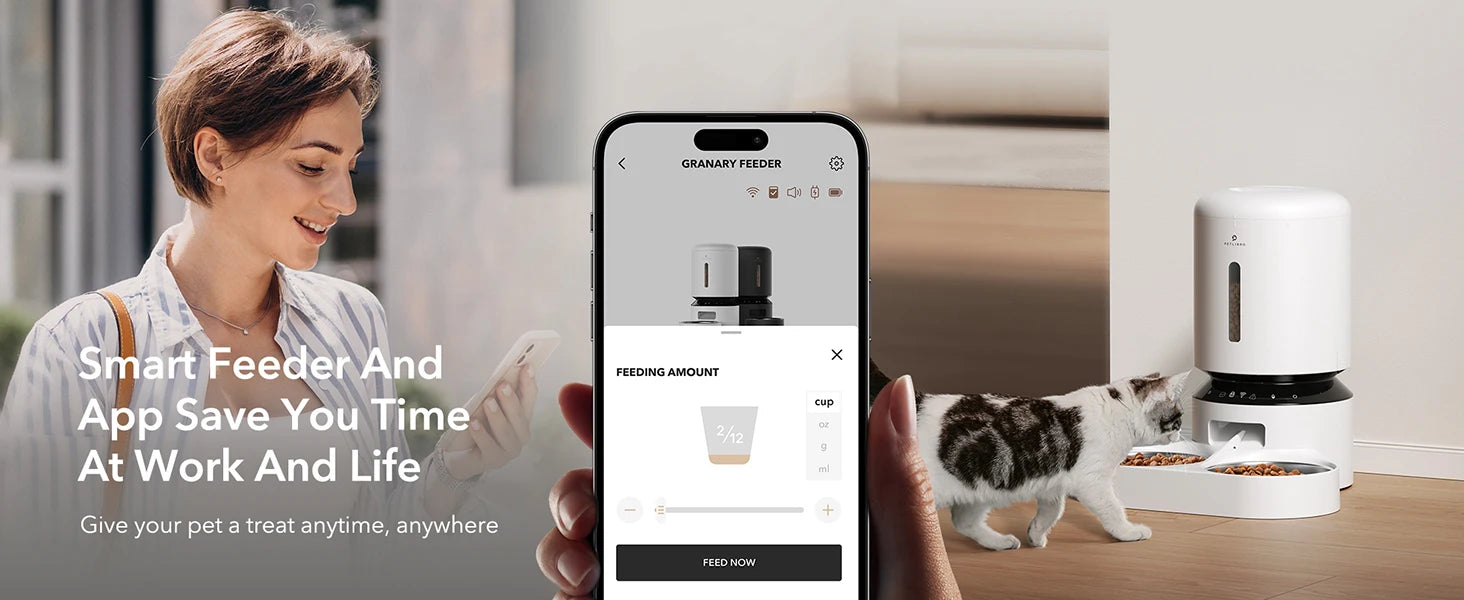 Woman using a smartphone app with a smart pet feeder displayed, showing a cat eating.