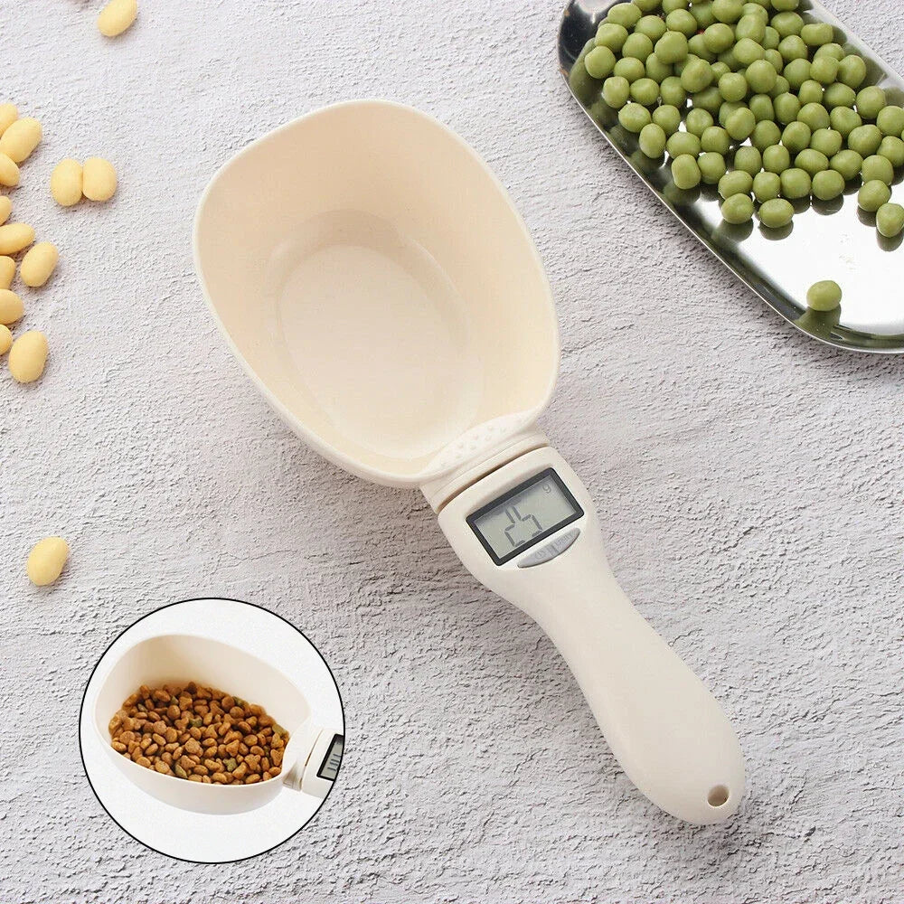Digital measuring scoop with a digital display on a light gray surface with small amounts of grains and peas.