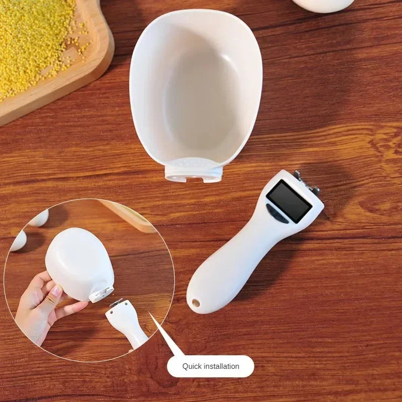 White electronic device with a screen on a wooden surface, showing installation process.