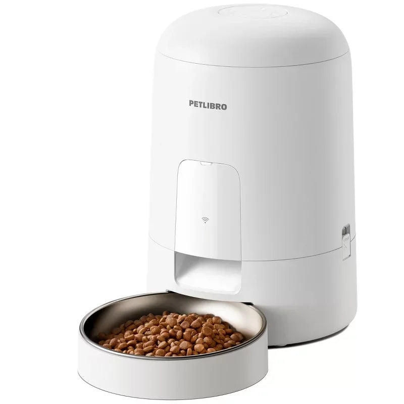 White pet food dispenser with a bowl of kibble on a white background