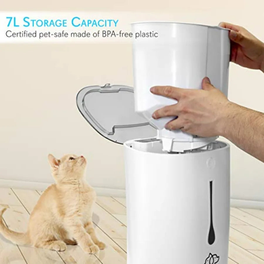 White pet food storage container with a cat looking inside, on a light wood floor.