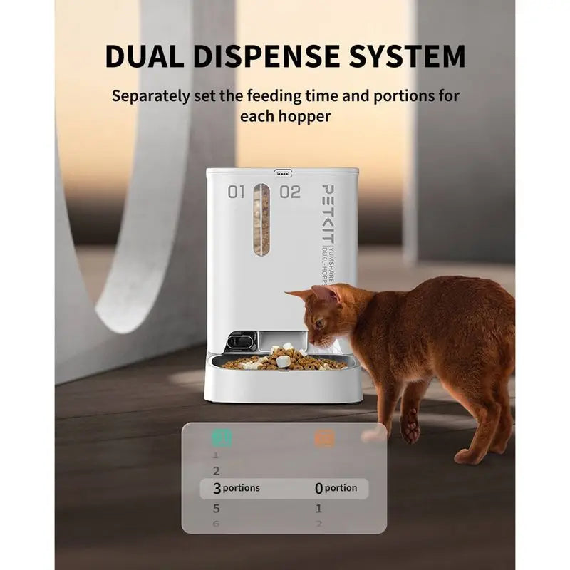 Petit T Pet Feeder with dual dispense system and a cat interacting with it.