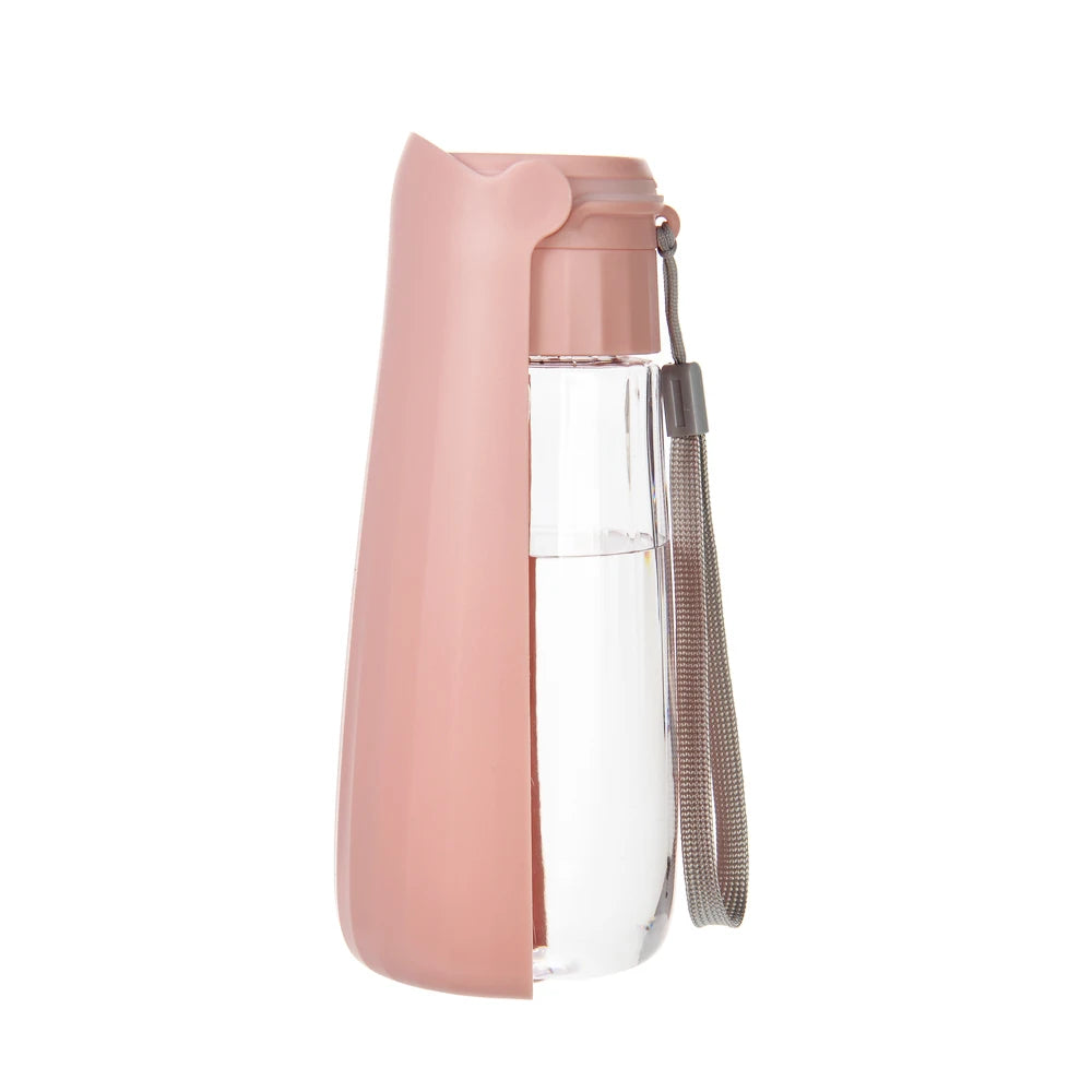 Pink water bottle with a clear plastic compartment on a white background