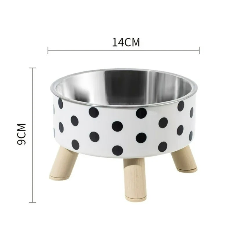 Pet bowl with polka dot design and wooden legs, shown with measurements on a white background.