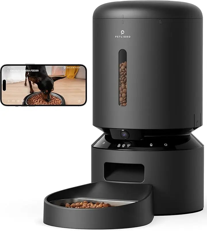 Black pet feeder with smartphone app interface on a white background